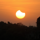 A partial solar eclipse sets over a minaret in Agra, India on July 22, 2009.